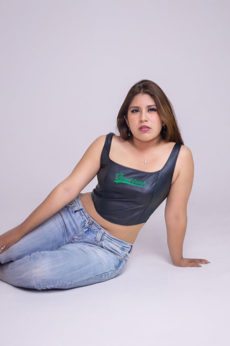 A woman sitting on the ground with her legs crossed